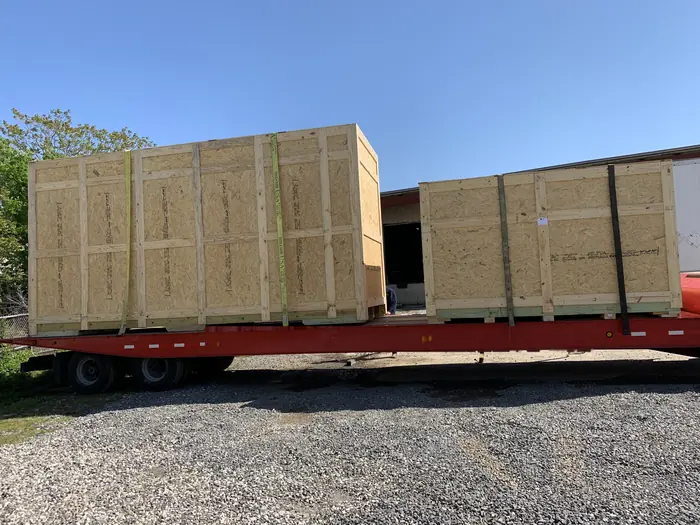 Two large crates strapped down and ready to roll.