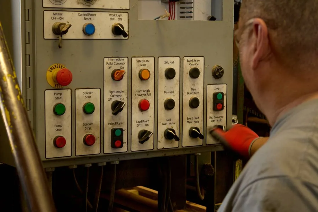 Operator at the pallet line controls in the Clinton facility